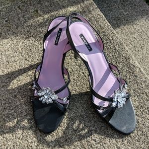 Black strappy heels with jewel